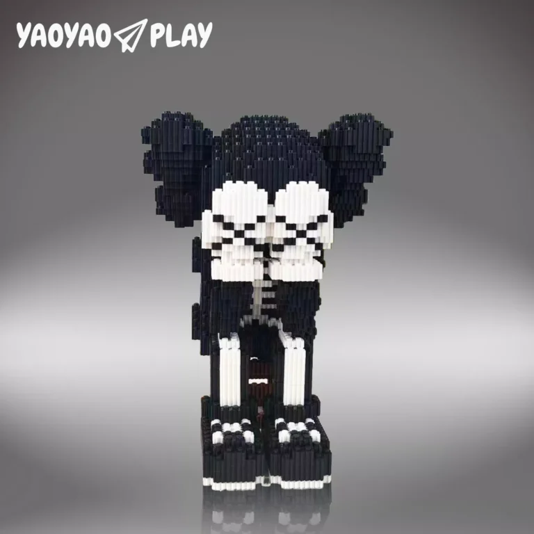 Pixel-art ​​Brick Bear toy​​ in black-and-white with precision joints on a neutral gray studio backdrop.