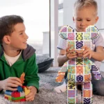 two boys playing with pixel bear toy set