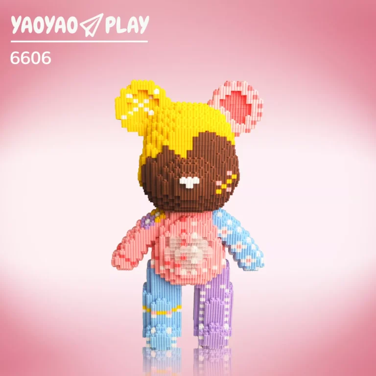 A ​​Brick Bear toy​​ with yellow head, white speckles, pink ears, and floral-patterned blue/purple limbs on a gradient pink backdrop.