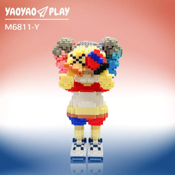 A red-and-yellow ​​Brick Bear toy​​ (Model M6811-Y) with checkered shoes and coral-to-azure gradient backdrop.