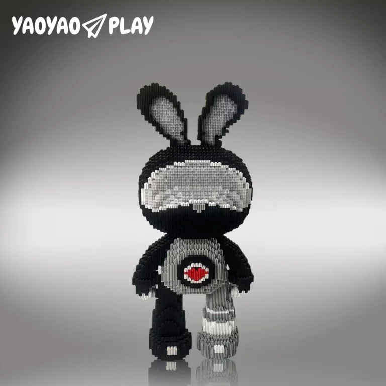 A black-and-white ​​Brick Bear toy​​ with red heart detail, posed against a gradient backdrop with "YAOYAO PLAY" branding.