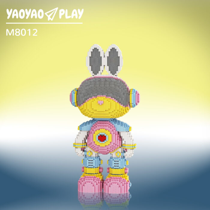 A ​​Brick Bear toy​​ (Model M8012) with gray ears, yellow head, pink heart torso, and blue armor on a yellow-to-navy gradient