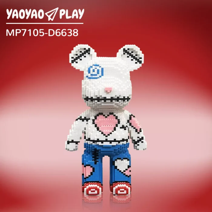 White-and-blue building blocks brick bear toy with pink heart torso, blue swirl eye patch, and 'YA0YAO PLAY' logo on red gradient.