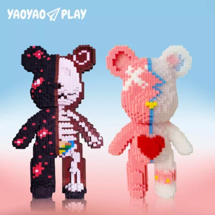 Left bear: Black/pink floral half with exposed rainbow digestive system. Right bear: Pink/white half with blue lightning motifs and red heart.