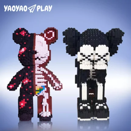 Side-by-side block sculptures symbolizing vitality (rainbow heart) and decay (skeletal design).