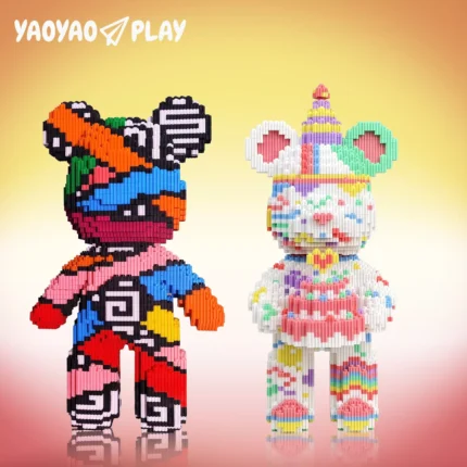Block sculptures juxtaposing bold stripes (left) and rainbow cake motifs (right) on a golden-pink gradient.